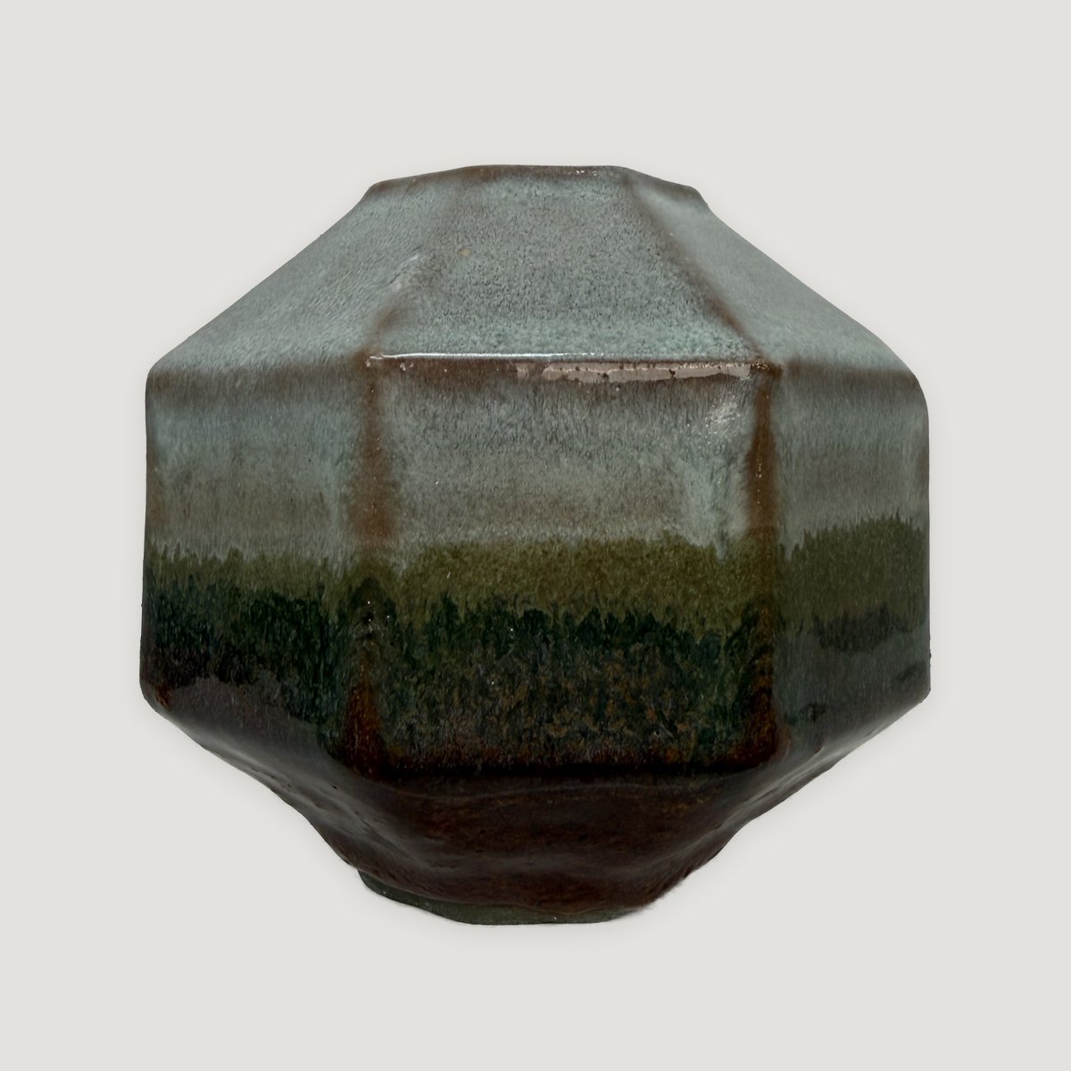 Octagonal pot, misty grey-blue shoulder banding into moss green and a dark iron base